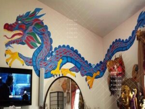 Mural of a blue eclectic hand painted dragon by Louis Ely in Madison Wisconsin of Lou Art.